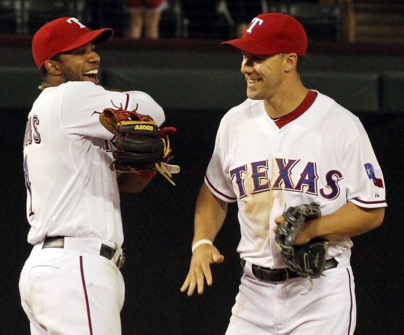 Texas shortstop Elvis Andrus and left fielder David Murphy are all smiles after the final...