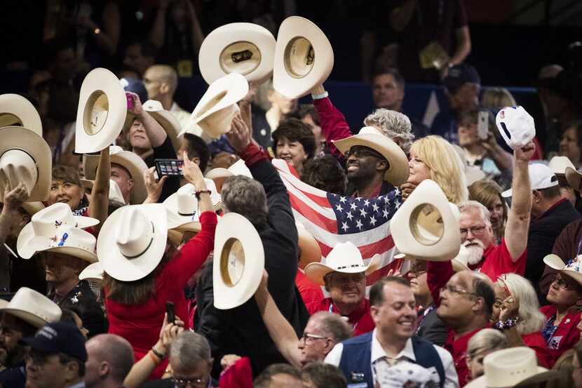 Texas delegates celebrate after New York cast the votes to put Donald Trump over the top as...