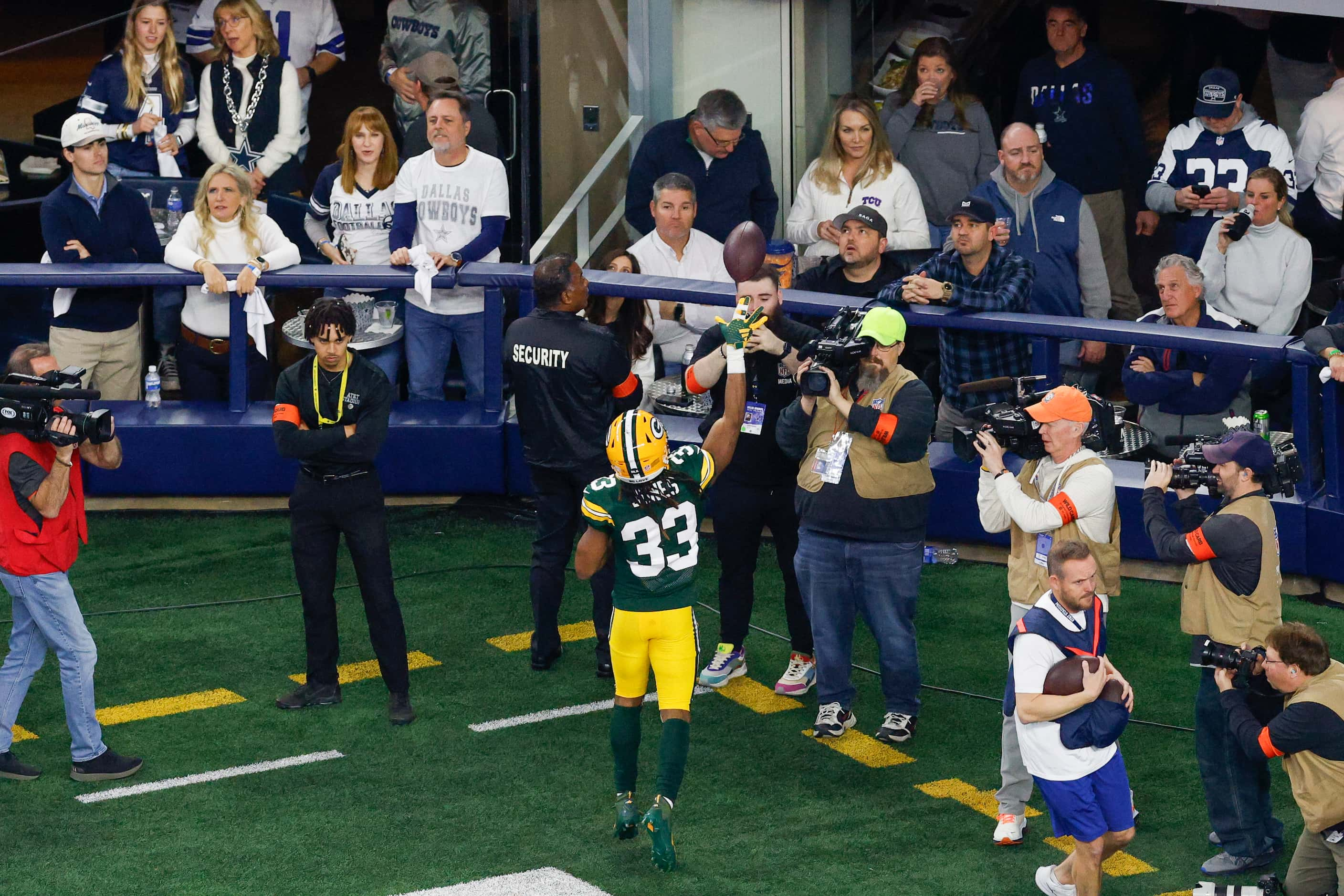 Dallas Cowboys linebacker Damone Clark (33) tosses the game ball to a fan after scoring a...