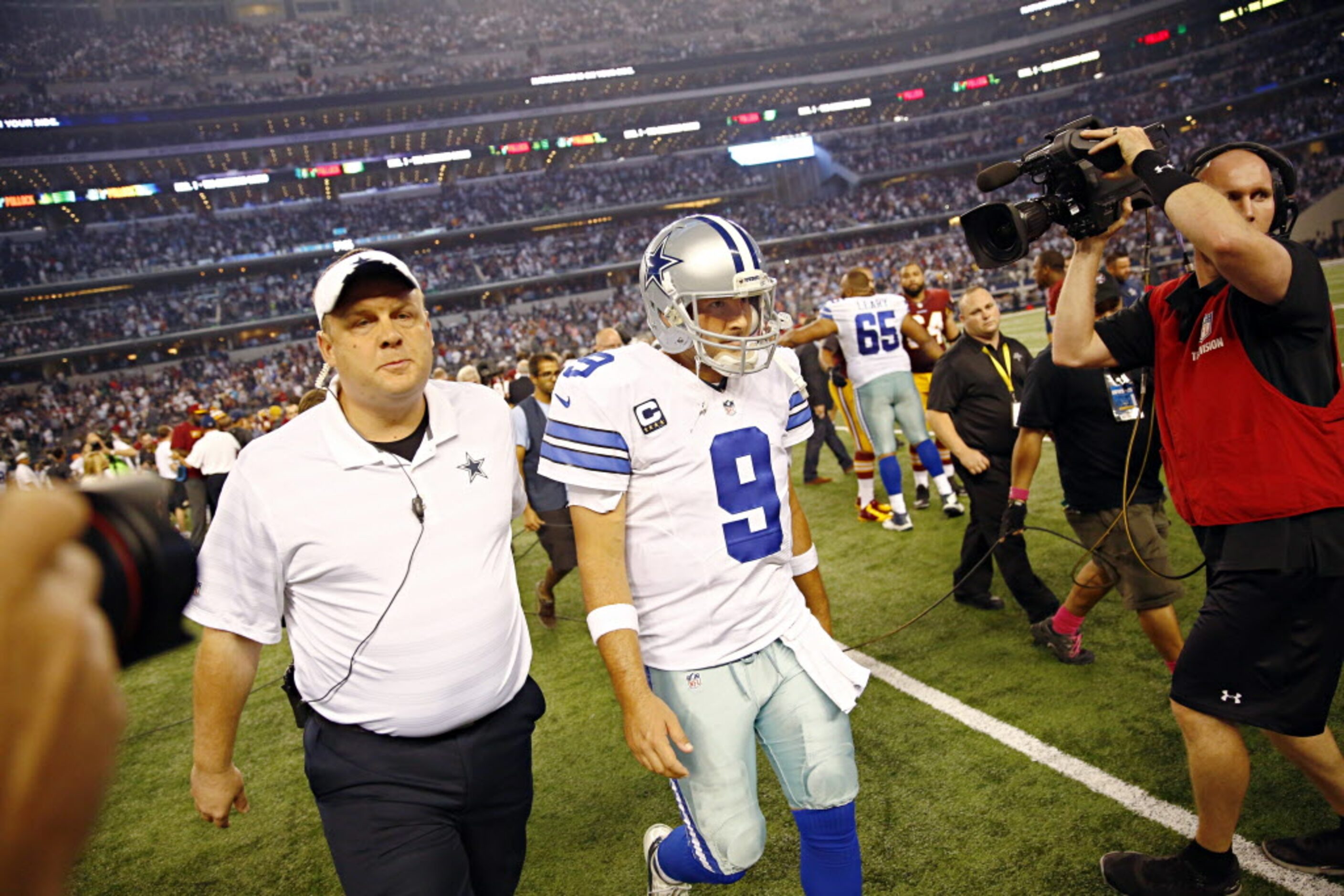 Dallas Cowboys quarterback Tony Romo (9) walks off the field following a 20-17 overtime loss...