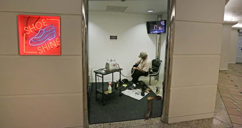 Larry Washington mans his shoe shine shop below the Bank of America Building in the tunnels...