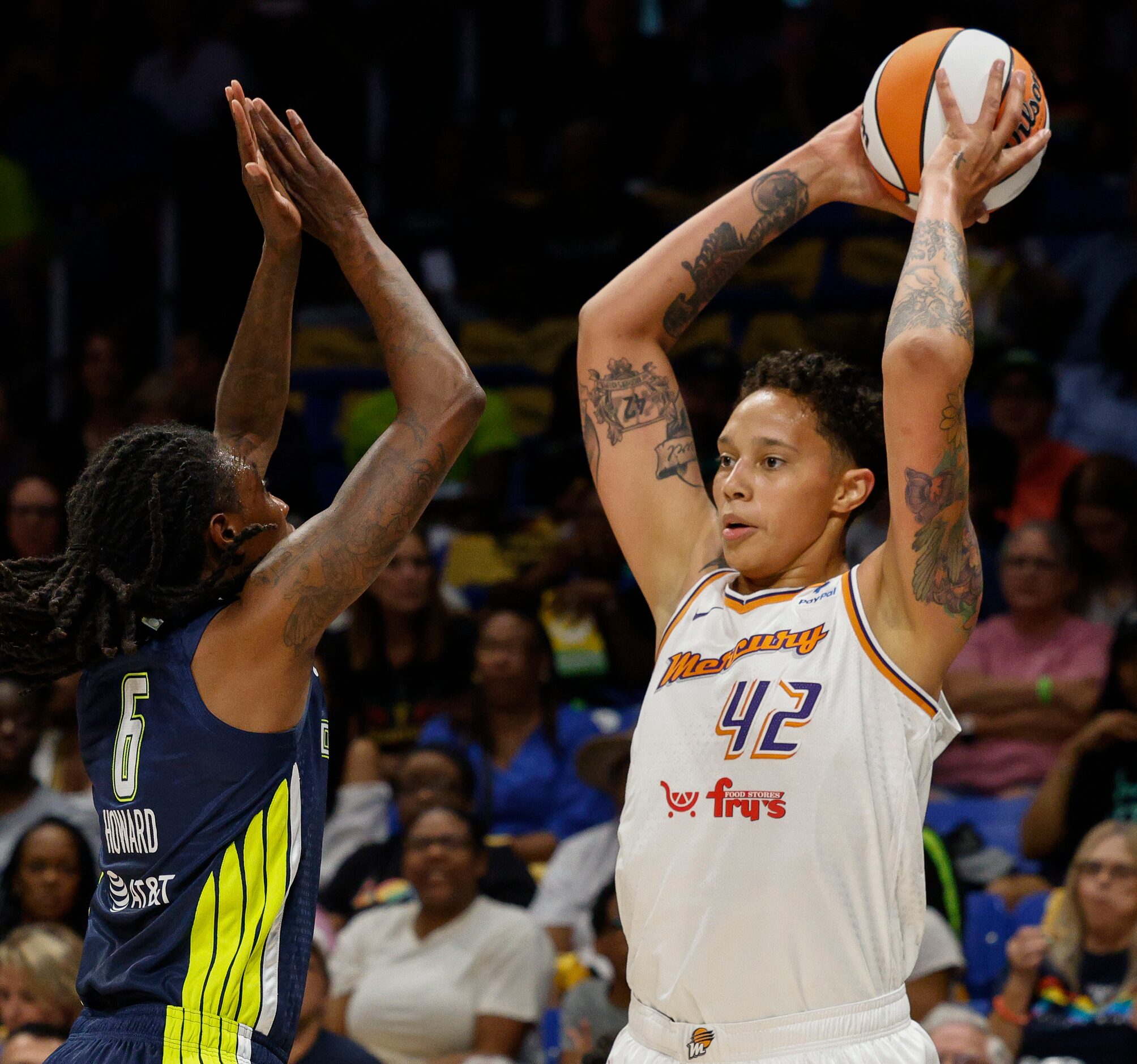 Phoenix Mercury center Brittney Griner (42) looks to pass over Dallas Wings forward Natasha...