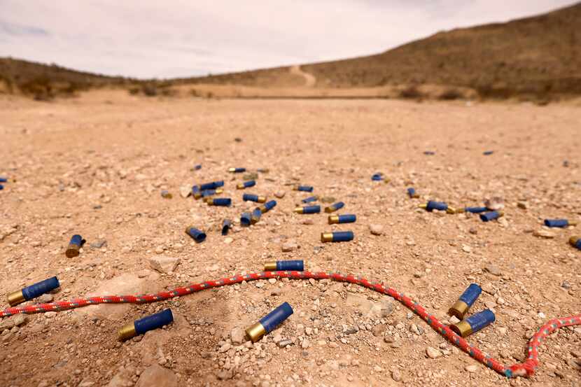 Used shotgun shell casings lie in the gravel at a public range in Sierra Blanca, Texas,...