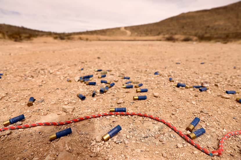 Used shotgun shell casings lie in the gravel at a public range in Sierra Blanca, Texas,...