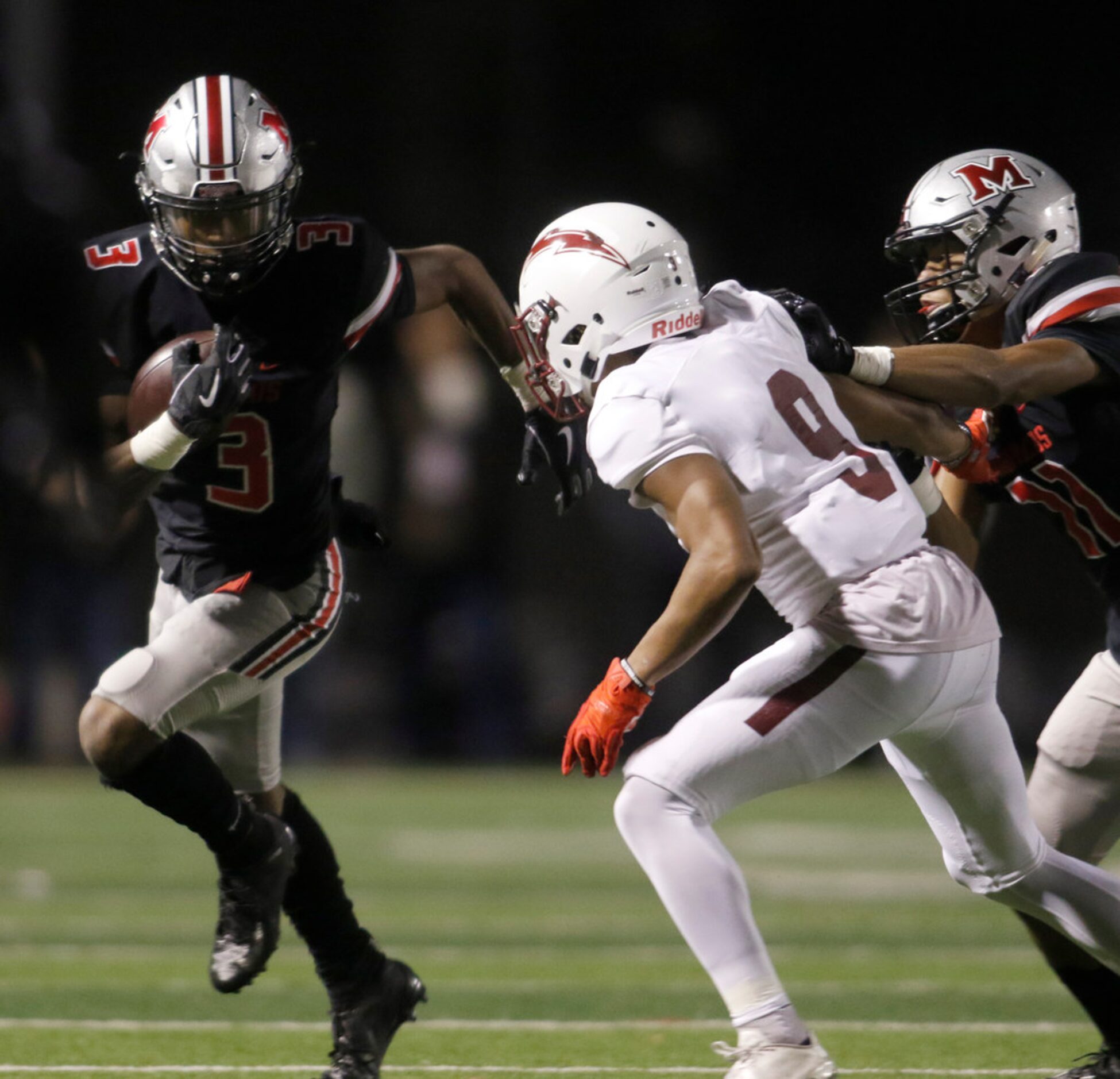 Flower Mound Marcus receiver Jalen Robinson (3) tacks on yardage after the catch as teammate...