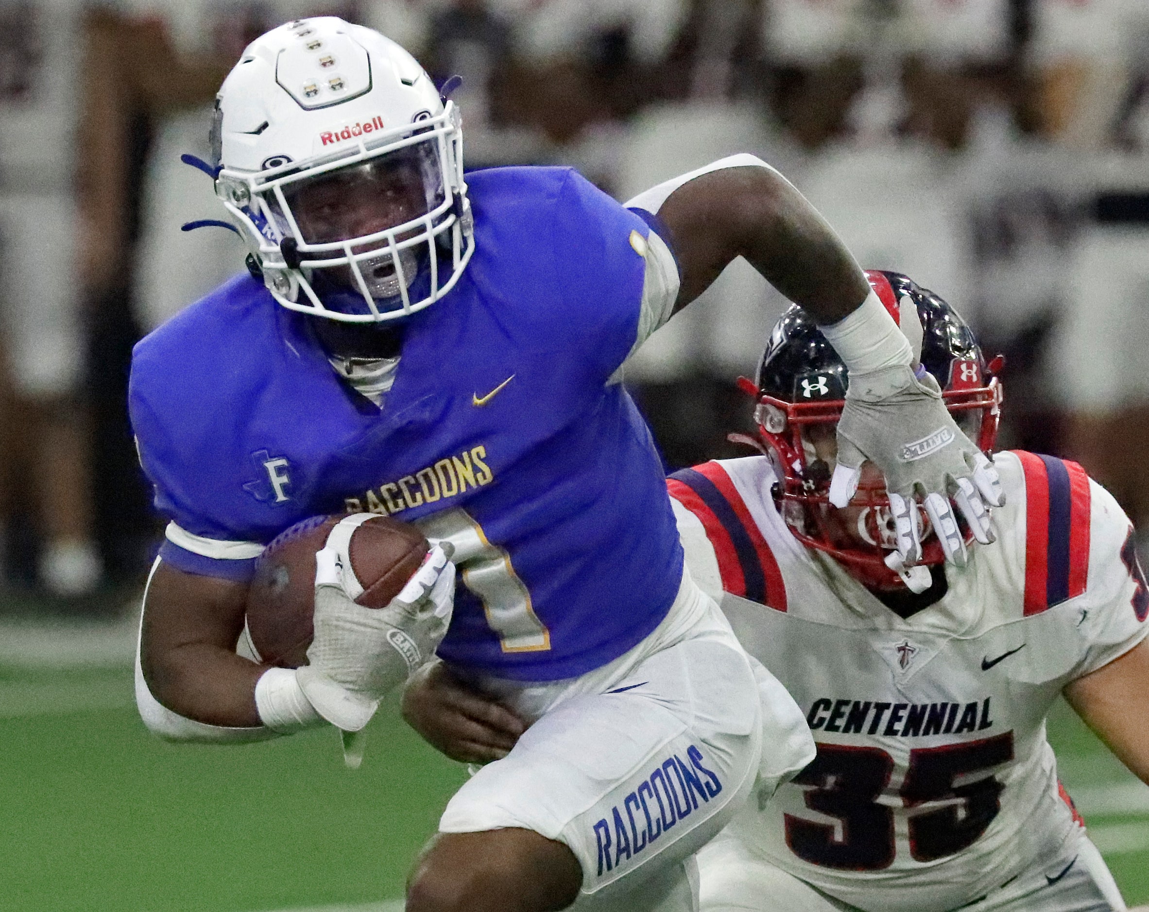 Frisco High School running back Kam Pendergraph (1) escapes Centennial High School defensive...