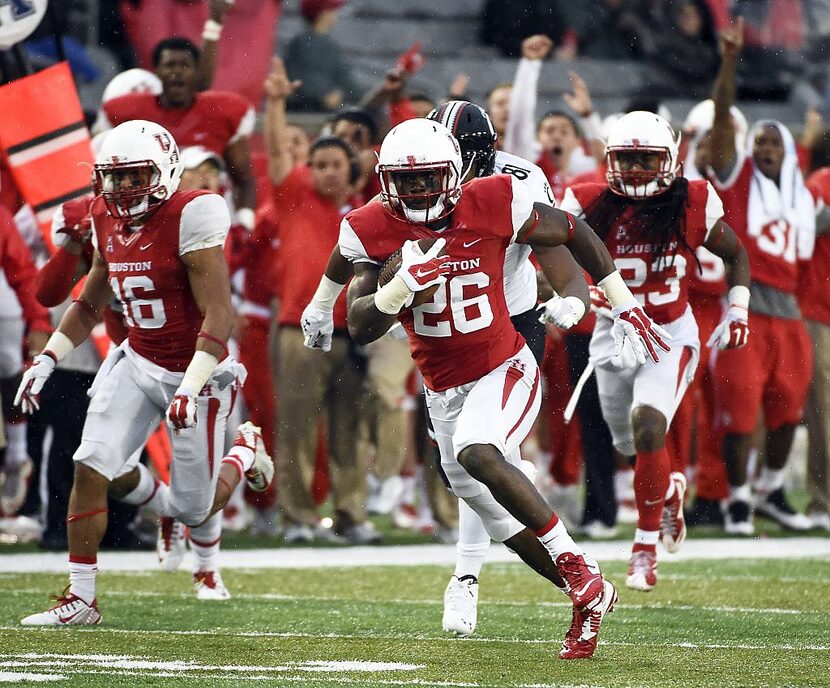 HOUSTON, TX - NOVEMBER 7: Brandon Wilson #26 of the Houston Cougars returns an interception...