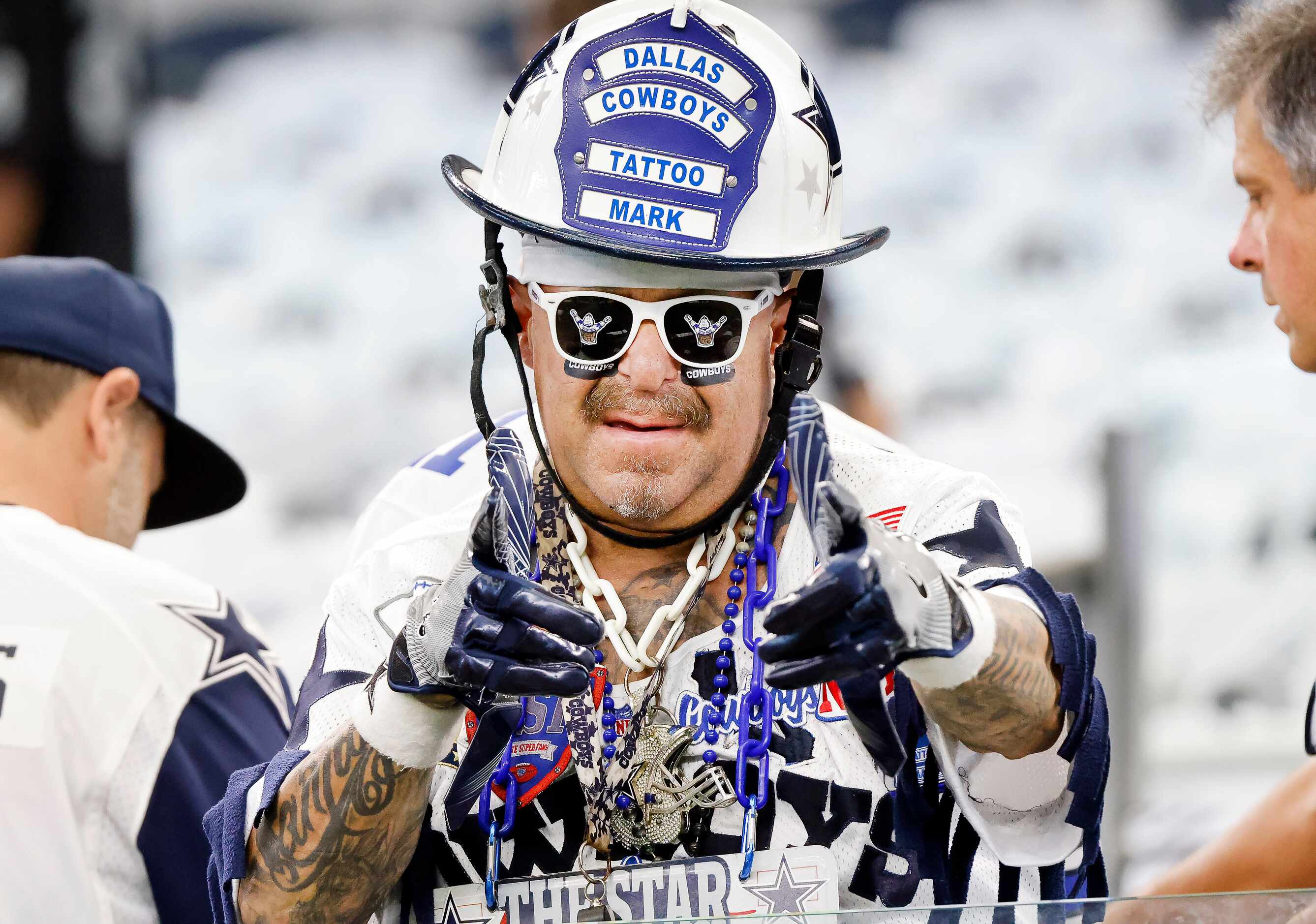 Dallas Cowboys fan Mark “Tattoo Mark” Shenefield  watches pregame warmups before the team...