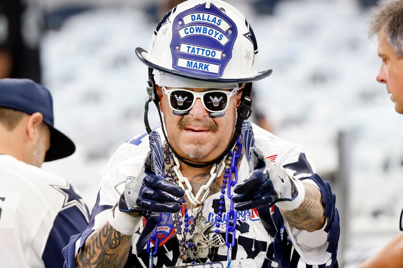 Dallas Cowboys fan Mark “Tattoo Mark” Shenefield  watches pregame warmups before the team...