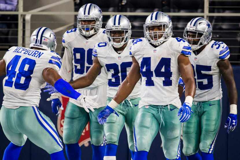 Dallas Cowboys celebrate with Dallas Cowboys cornerback Anthony Brown (30) after a touchdown...