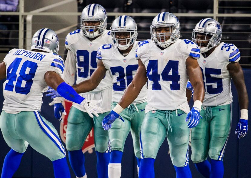 Dallas Cowboys celebrate with Dallas Cowboys cornerback Anthony Brown (30) after a touchdown...