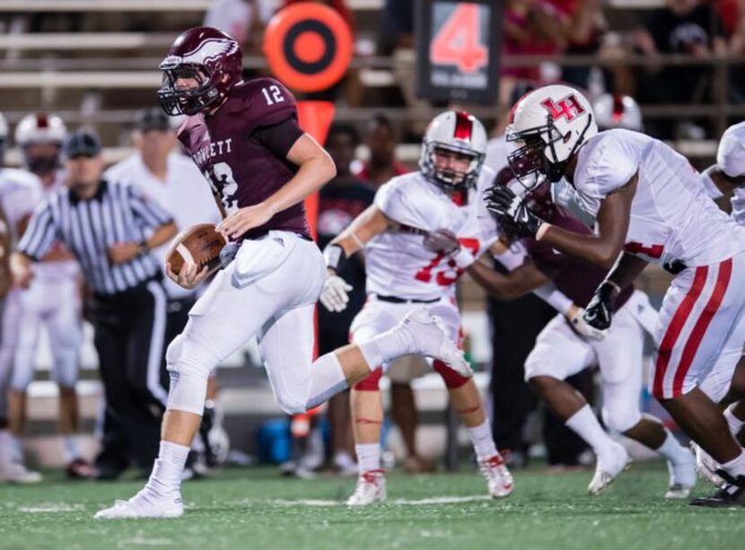 
Rowlett junior quarterback Logan Bonner (12) takes off against Lake Highlands on Sept. 4....