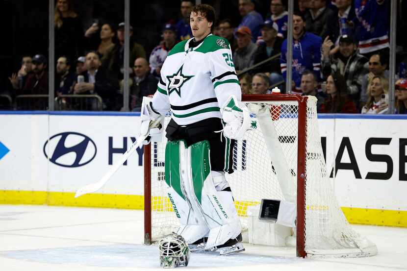 Dallas Stars goaltender Jake Oettinger reacts after being called for a delay of game penalty...