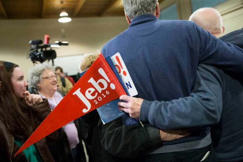  Republican presidential candidate, former Florida Gov. Jeb Bush takes pictures with...