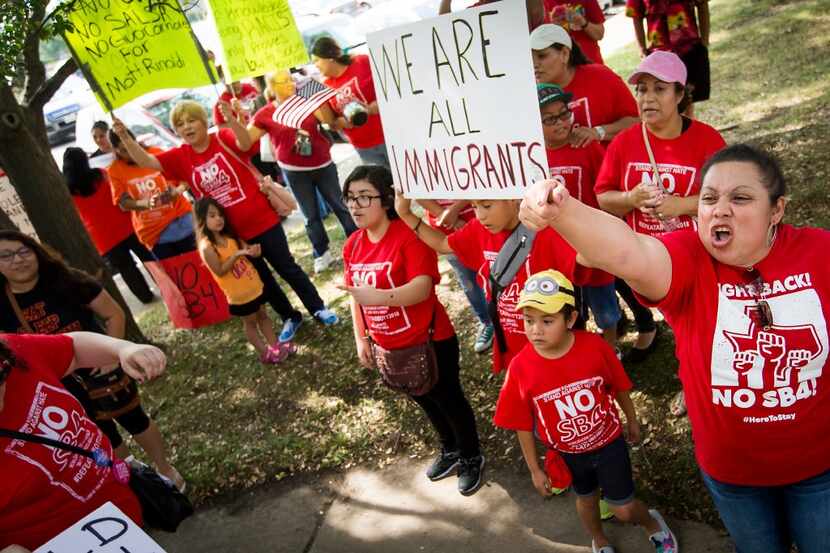 Zoila Chaver (right) was among those protesting Texas' sanctuary cities ban at a rally in...