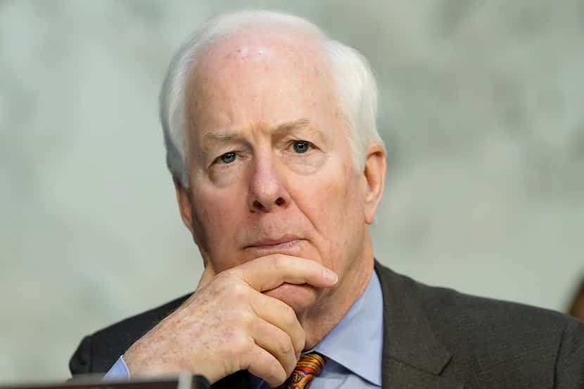 FILE - Sen. John Cornyn, R-Texas, listens on Capitol Hill in Washington, March 23, 2022.