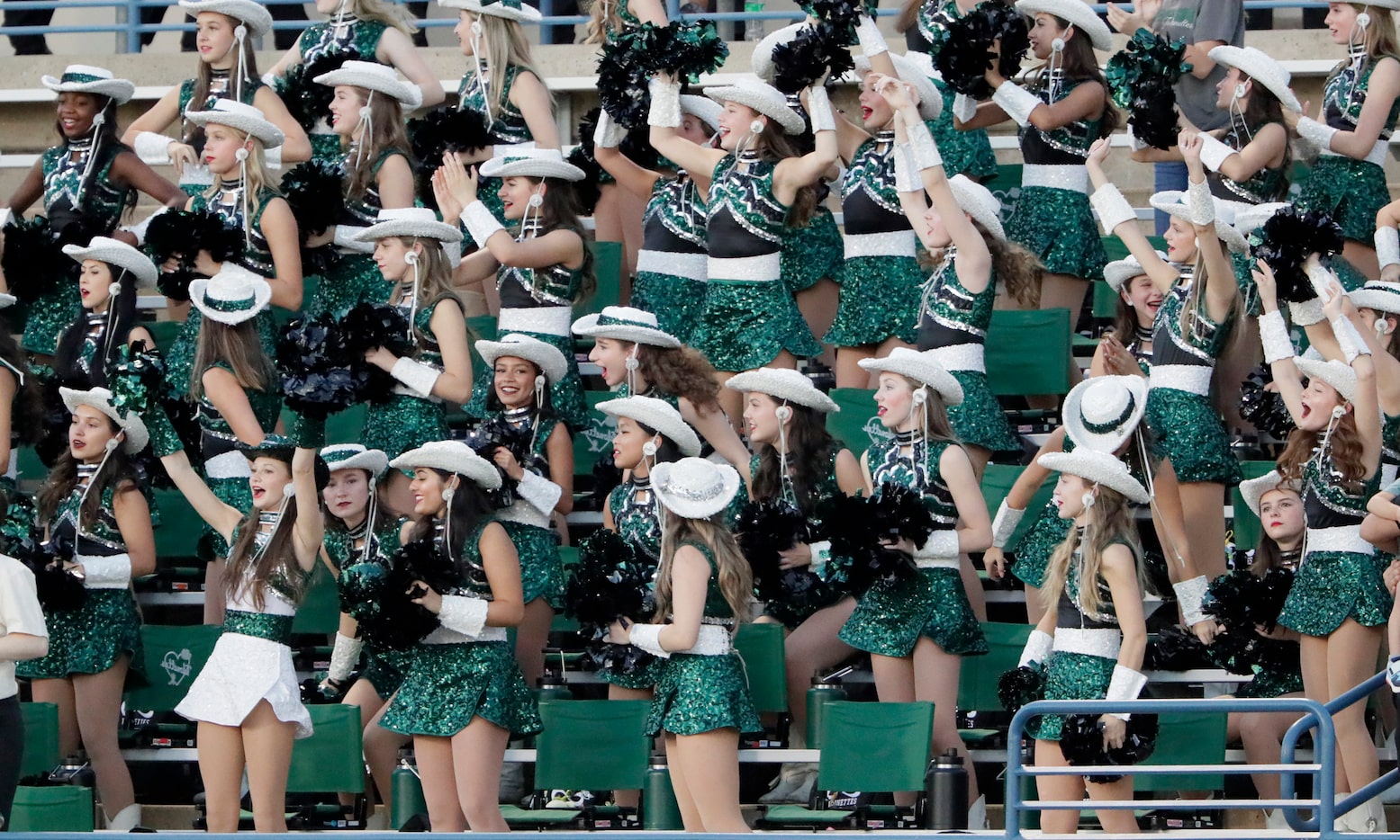 The Prosper High School drill team cheer a touchdown during the first half as Plano East...