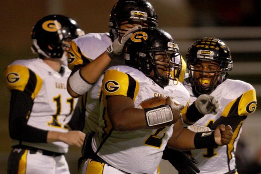 Garland running back Malcolm Miller (2) was all smiles after scoring the game's first...
