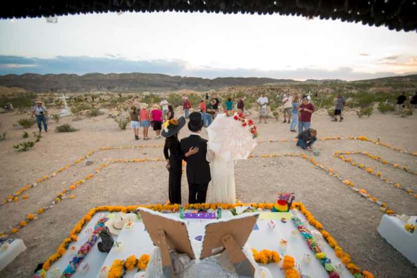 
Participants in the Terlingua Ghost Town Dia De Los Muertos celebration pose for a photo in...