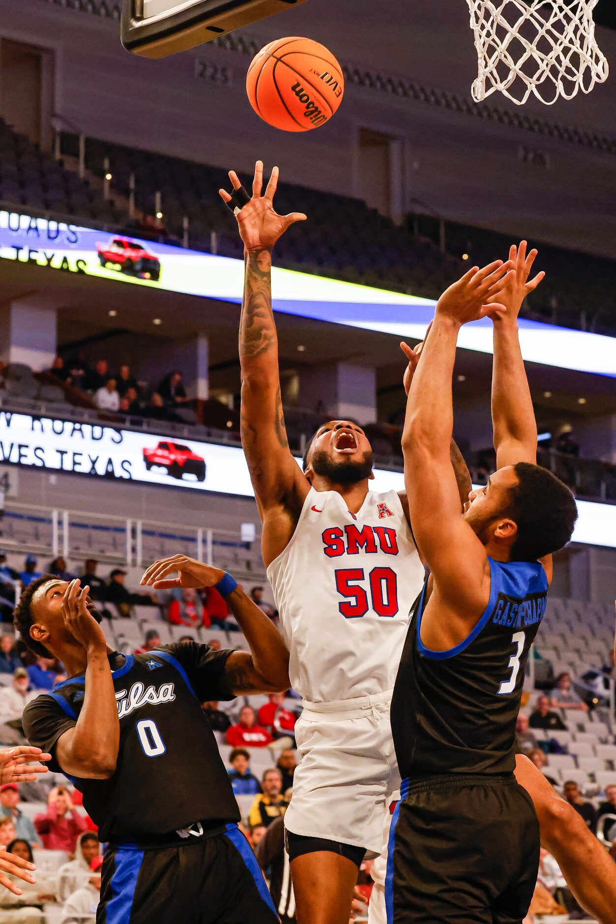 Southern Methodist Mustangs forward Marcus Weathers (50) loses the ball after a foul between...