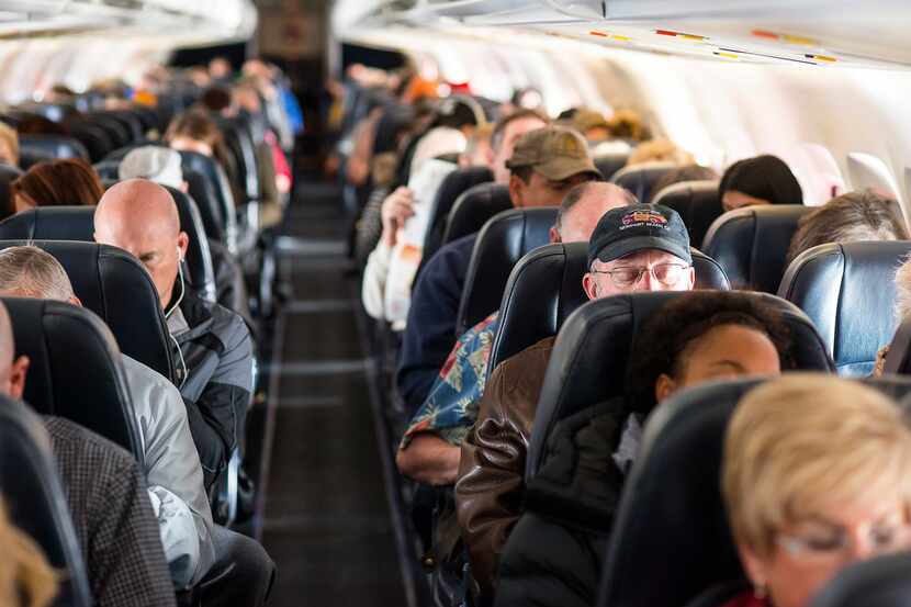 FILE -- Passengers aboard an Allegiant Airlines flight between Colorado Springs, Colo., and...