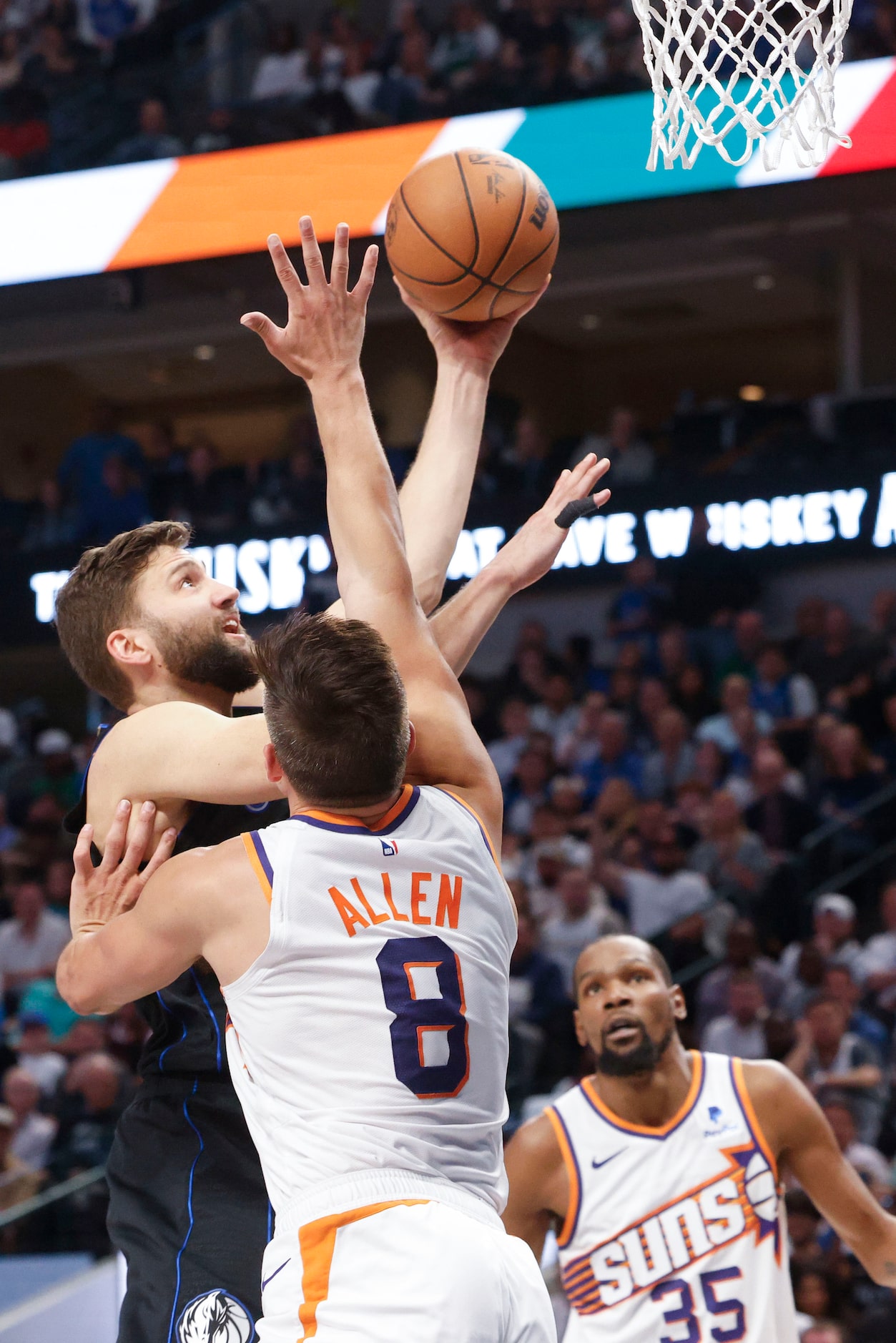 Dallas Mavericks forward Maxi Kleber (back) drives to the basket past Phoenix Suns guard...