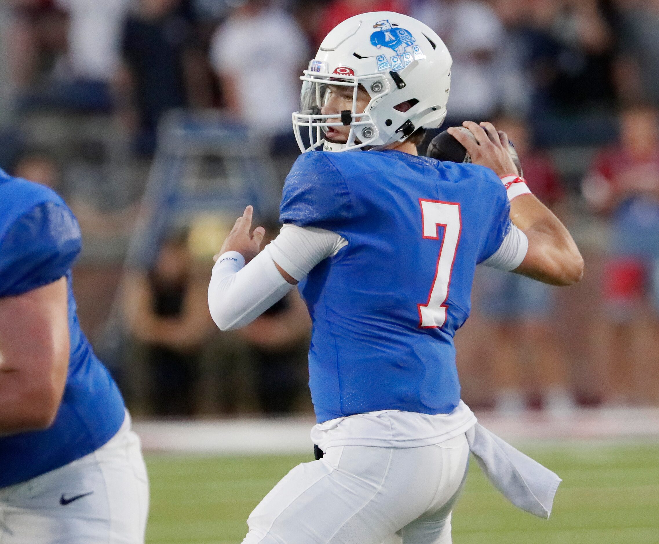 Allen High School quarterback Brady Bricker (7) makes a pass attempt during the first half...