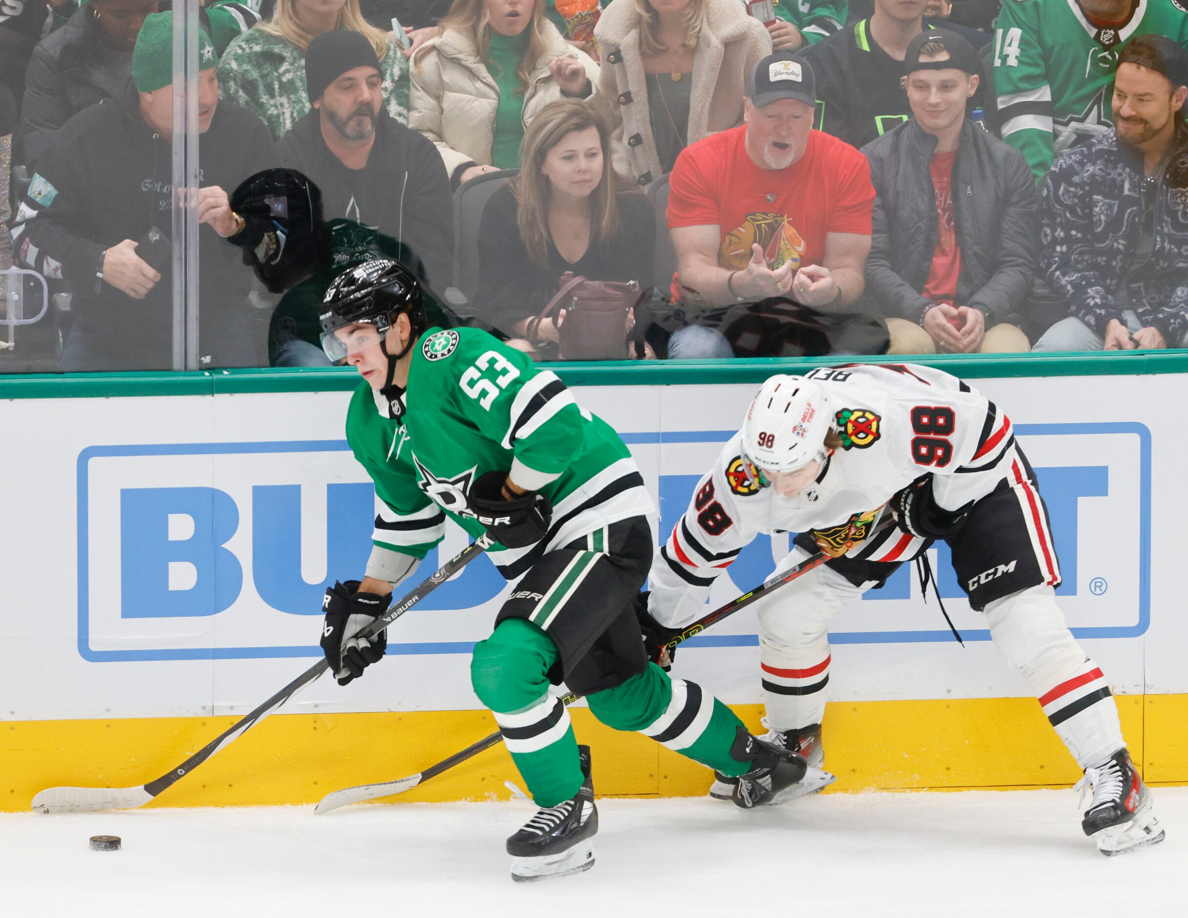 Dallas Stars center Wyatt Johnston (53) goes past Chicago Blackhawks center Connor Bedard...