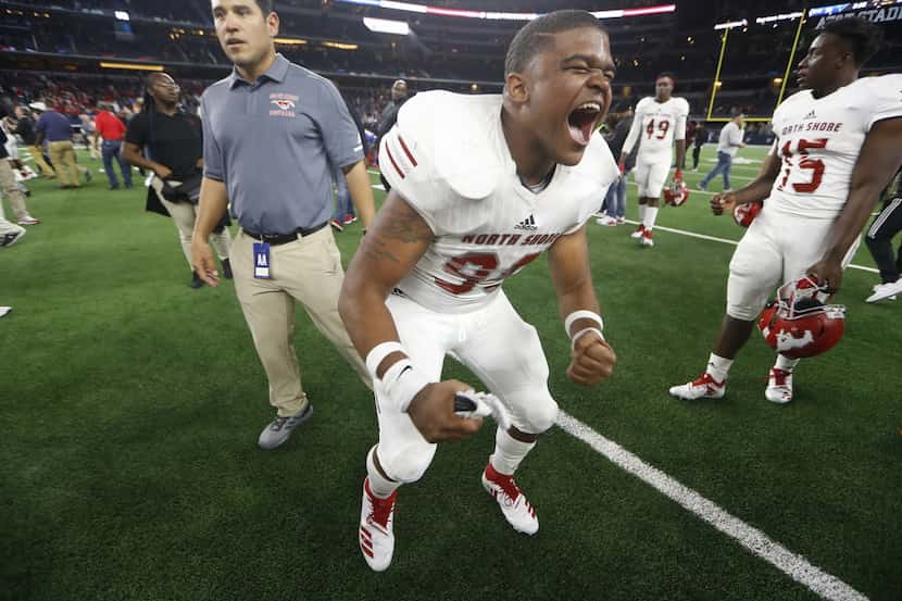 Galena Park North Shore's Trey Cole (99) cheers after winning the  Class 6A Division I...