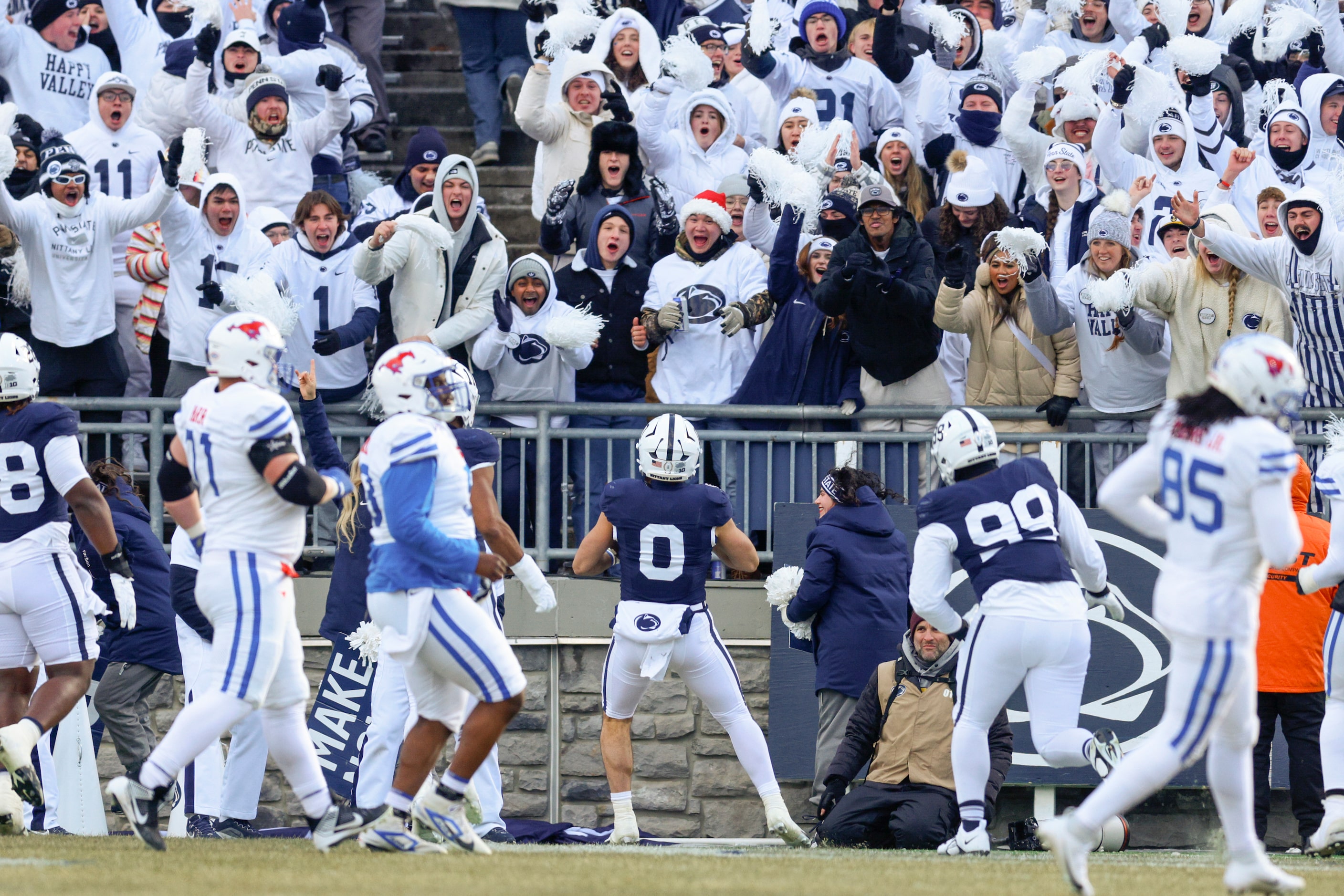 Penn State fans celebrate an interception returned for a touchdown by linebacker Dominic...