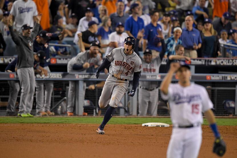 Houston Astros' George Springer celebrates after a home run against the Los Angeles Dodgers...