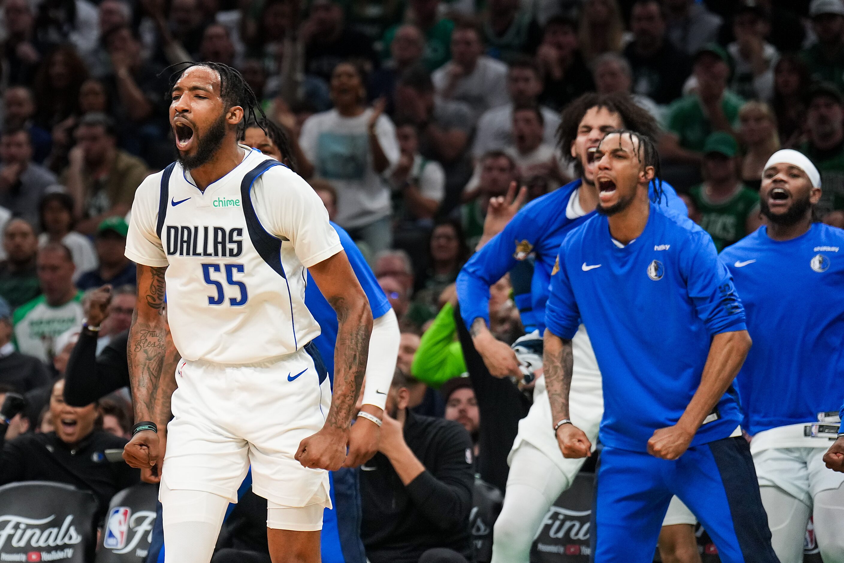 Dallas Mavericks forward Derrick Jones Jr. (55) celebrates after a basket during the first...