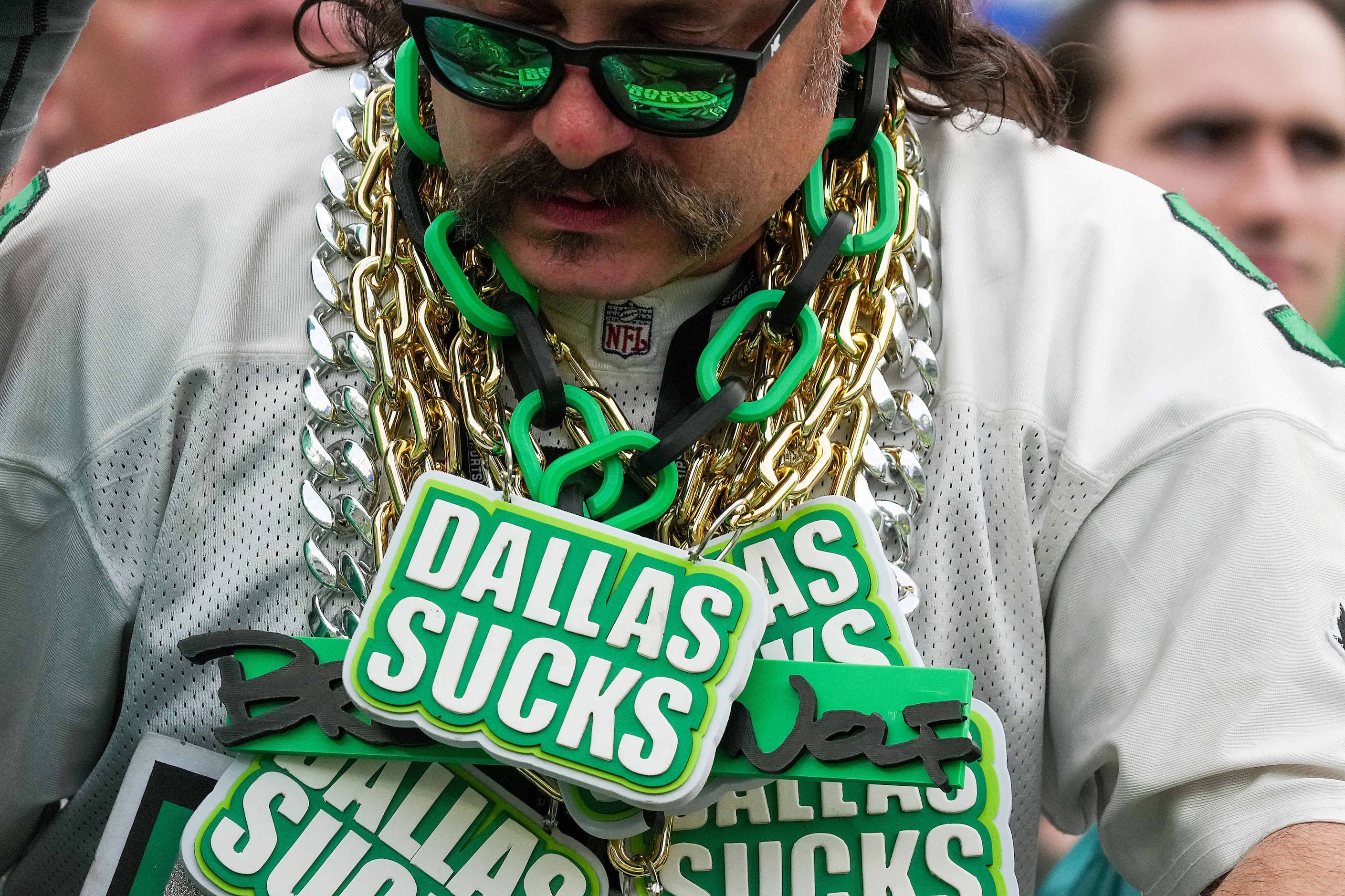 A Philadelphia Eagles fan wears multiple chains disparaging the Dallas Cowboys during the...