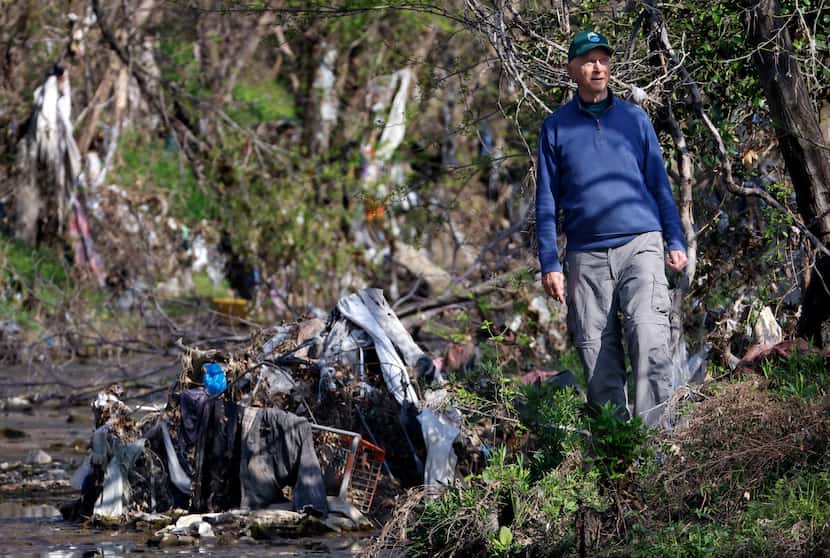 Garrett Boone tours the debris from homeless encampments and illegal dumping that's washed...