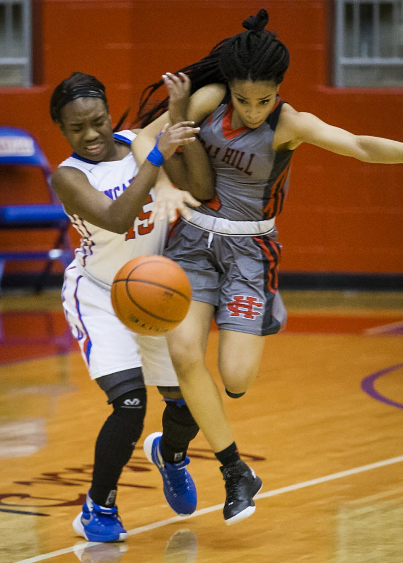 Duncanville guard Tae Davis (15) collides with Cedar Hill guard Lindsey Ogbonna (3) during...