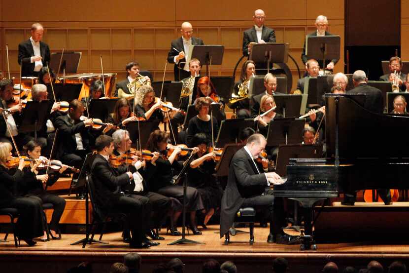 The Dallas Symphony Orchestra with pianist Garrick Ohlsson and conductor Hans Graf, as they...