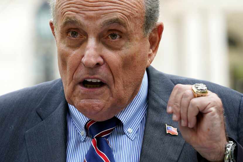 FILE - Former New York City Mayor Rudy Giuliani speaks during a news conference June 7,...