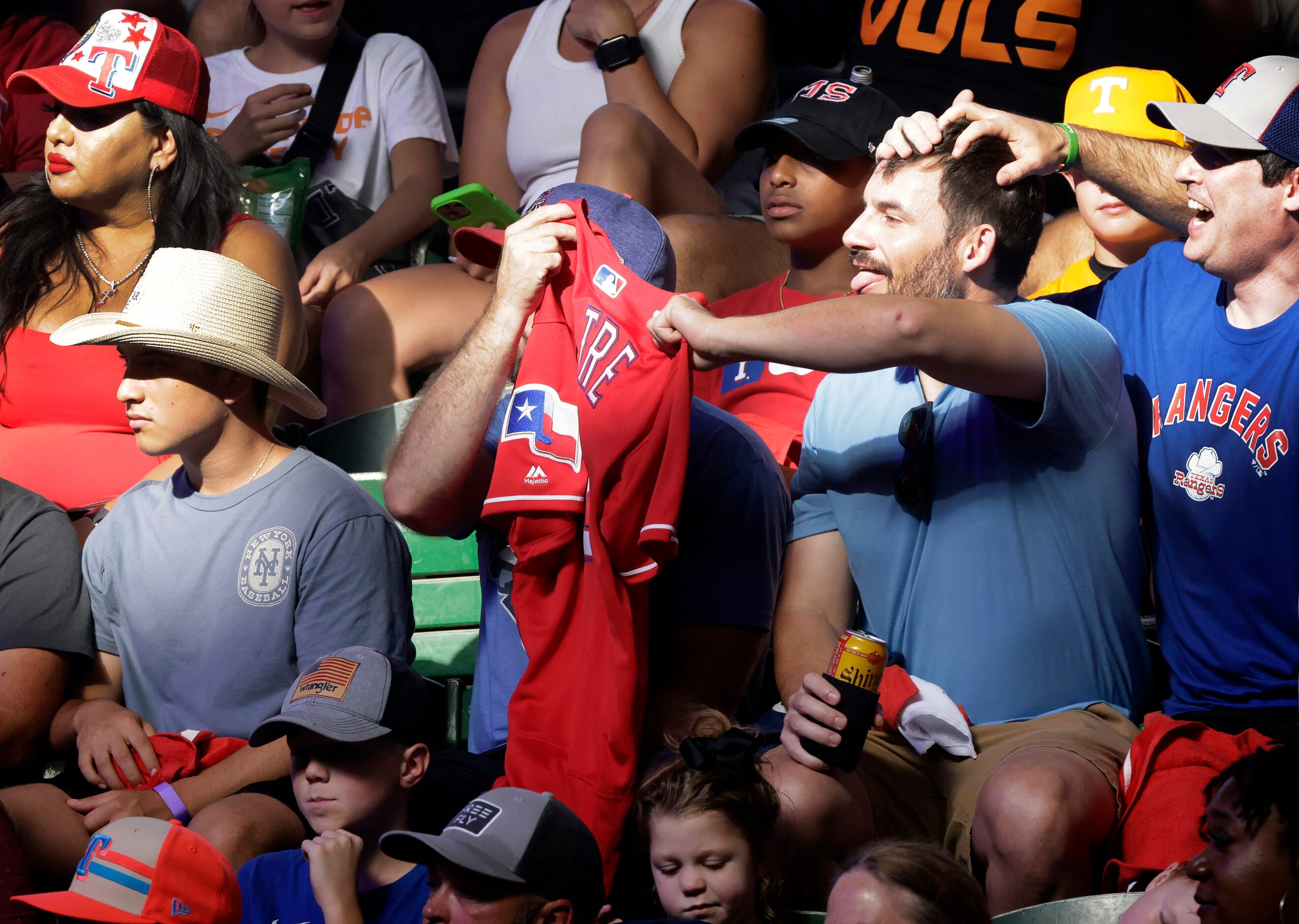 Fans of Texas Rangers newest Hall of Famer Adrian Beltre waves his jersey as he’s introduced...