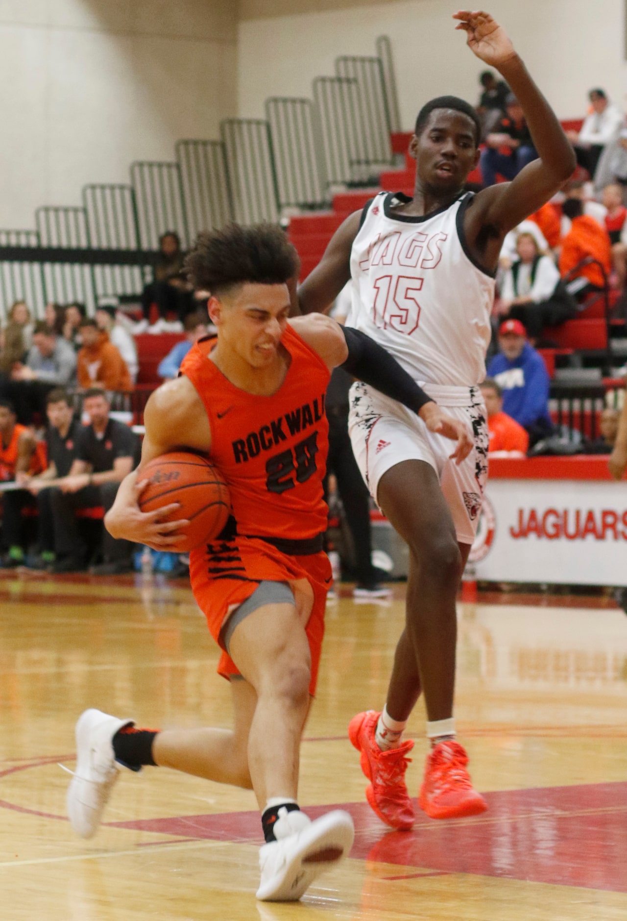 Rockwall's Will Bartoszek (20) drives against the defense of Mesquite Horn's Jarrell King...