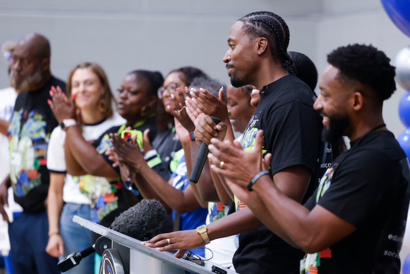 For Oak Cliff founder Taylor Toynes (center) introduces part the Far Oak Cliff team to...