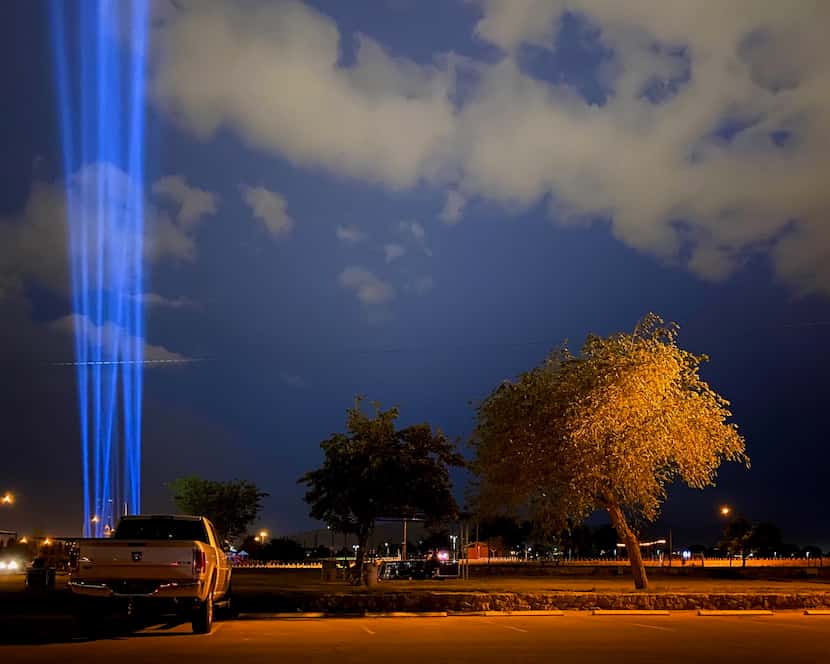 As part of the one-year memorial ceremonies, El Paso sent 23 beams of blue light shining...