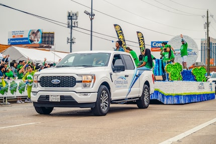 A Comerica Bank Ford F-150 from the pulls the bank’s float in the annual St. Patrick’s...