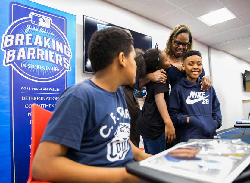 Sharon Robinson, daughter of baseball Hall of Famer Jackie Robinson, hugged students from...