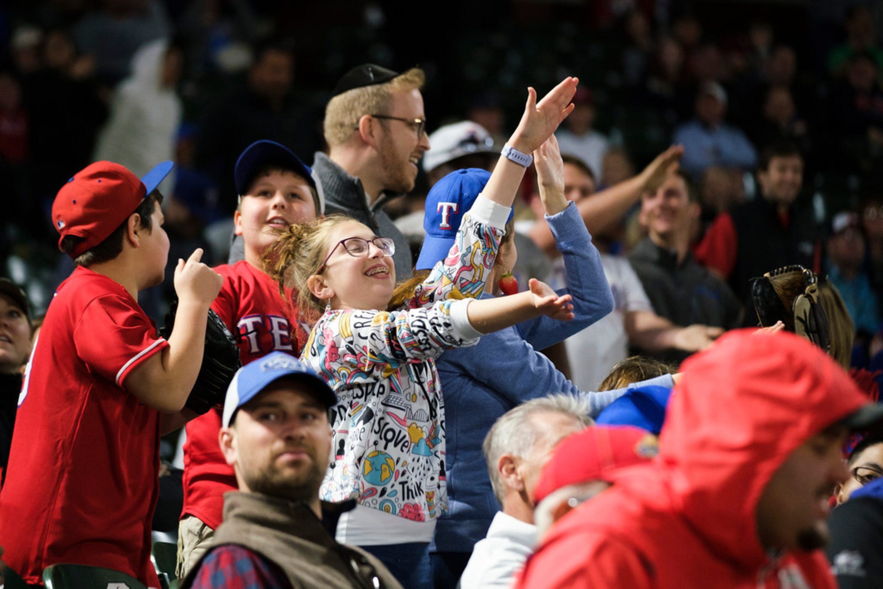 Fans do the Ã’Baby SharkÃ dance to celebrate a double by Texas Rangers shortstop Elvis...