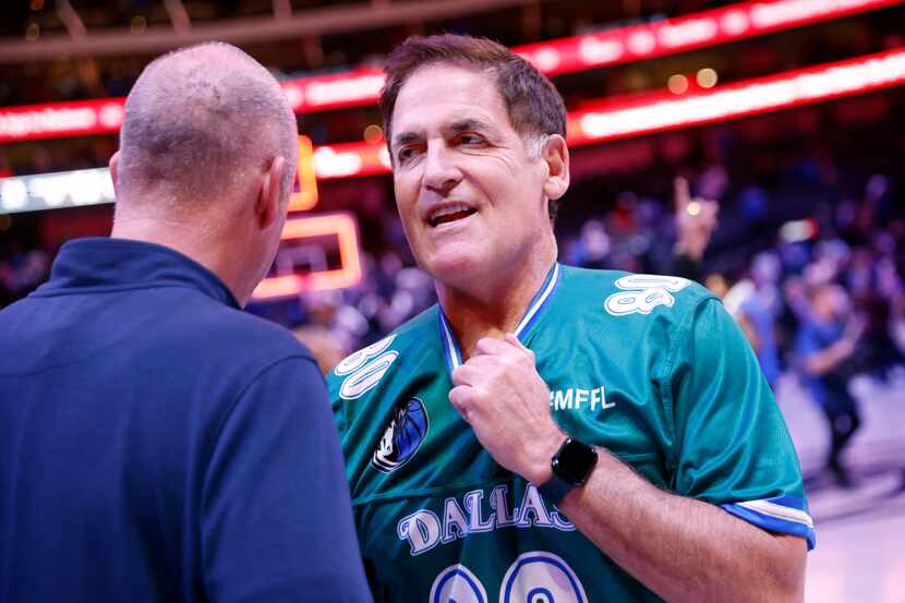Dallas Mavericks part-owner Mark Cuban visits with Vice President of Security Brian Kinzig...