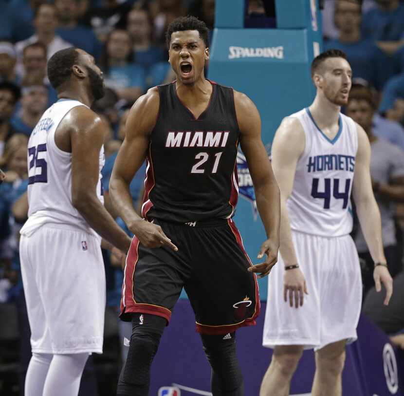 FILE - In this Friday, April 29, 2016, file photo, Miami Heat's Hassan Whiteside (21) reacts...