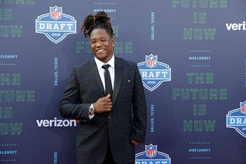 Central Florida's Shaquem Griffin poses for photos on the red carpet before the first round...