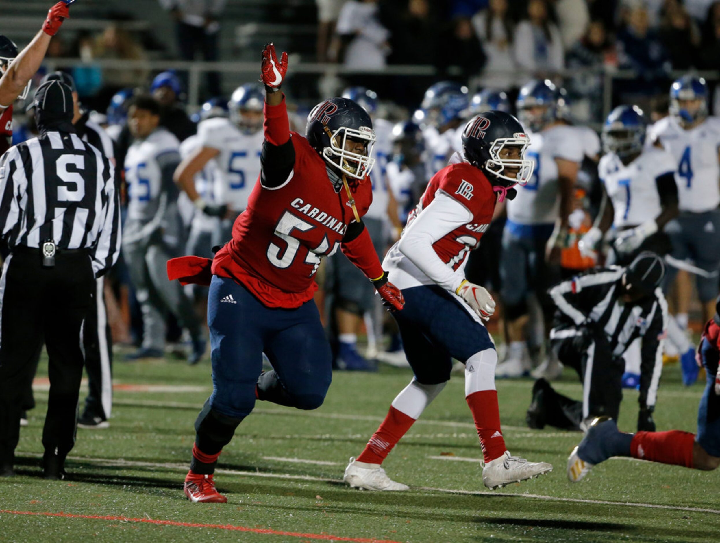 John Paul II defensive lineman Dylan Harris (54) celebrates after Nolan turned the ball over...