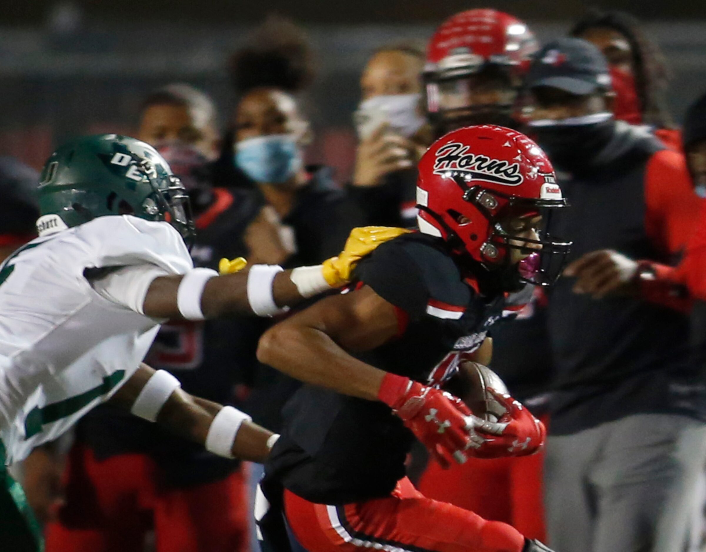 Cedar Hill Longhorns receiver Javien Clemmer (13) tacks on yardage after a reception as...