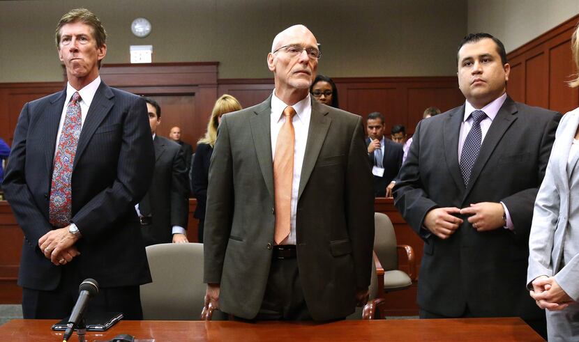 George Zimmerman, right, stands with his team defense, Mark O'Mara and Don West, as the jury...